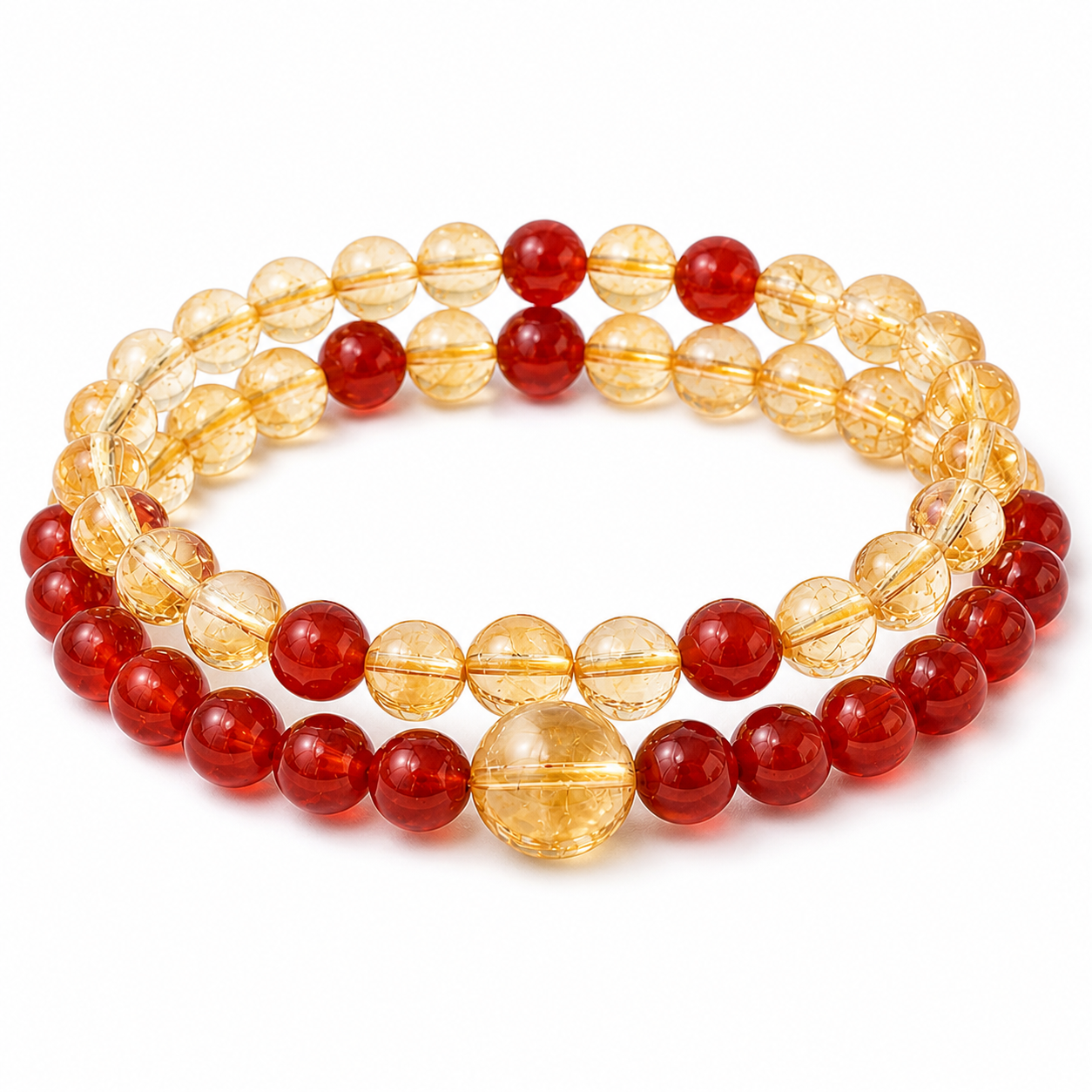 Gold and red crystal bracelet on a white background