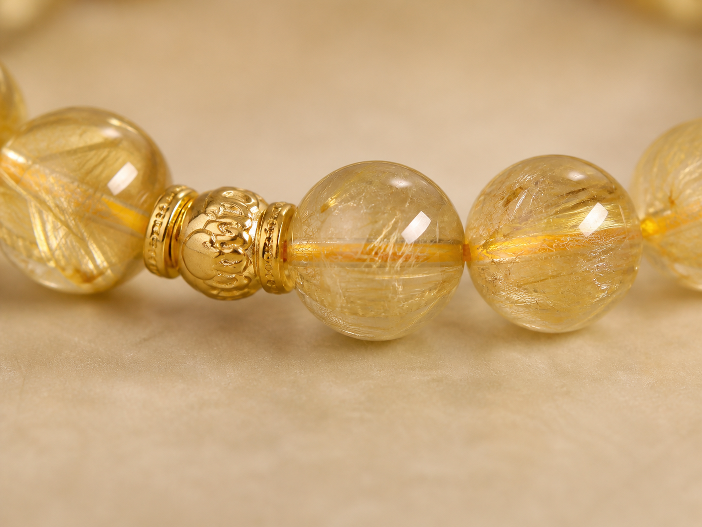 Cat’s-eye and rutilated quartz bracelet worn in a lifestyle setting
