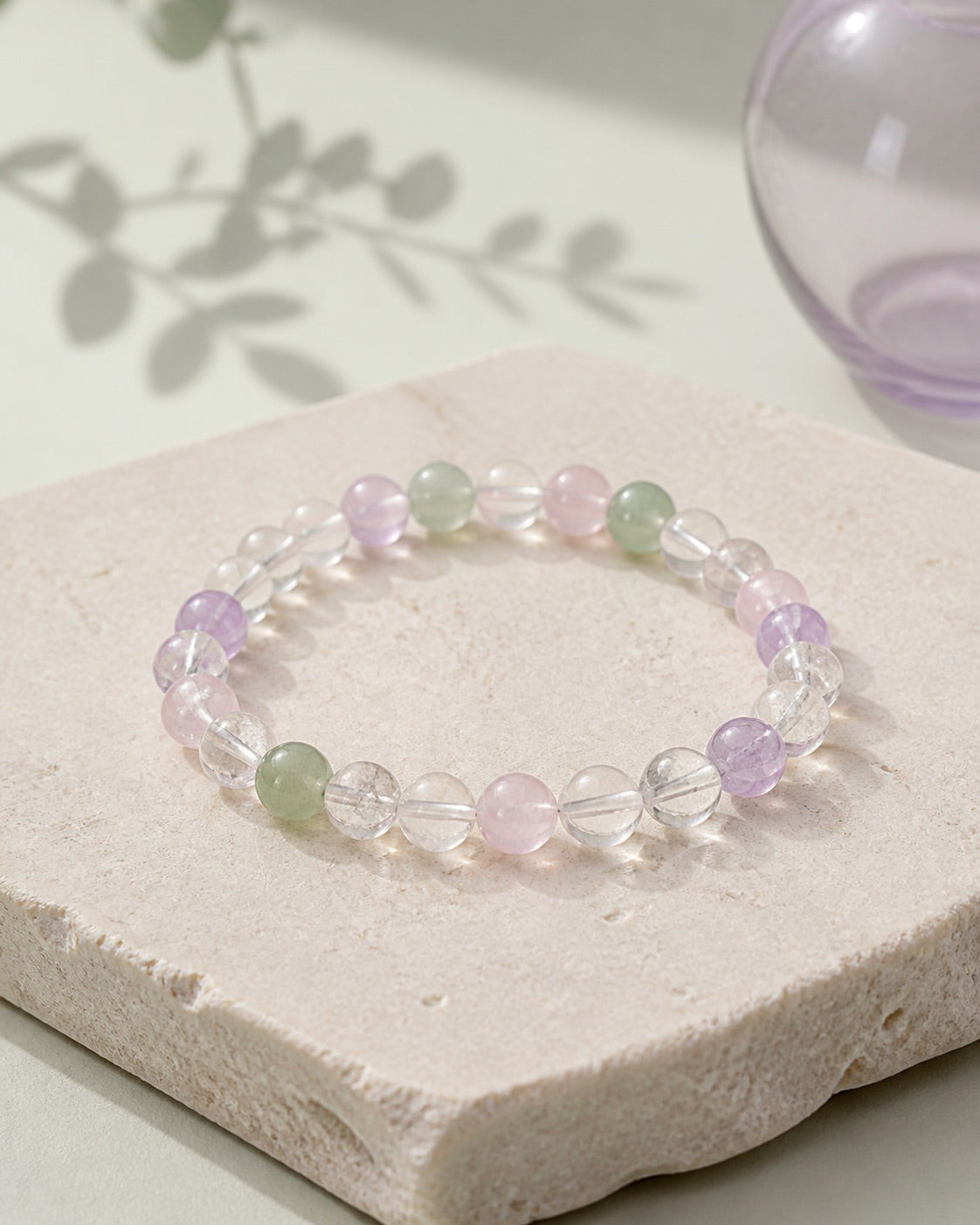 Natural crystal bracelet with clear, rose, green, and lavender beads